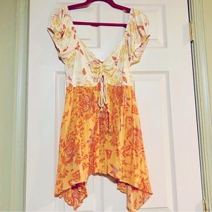 Free People cap sleeve asymmetrical flowy tie front keyhole top size M
